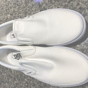 White Vans slip on sneakers